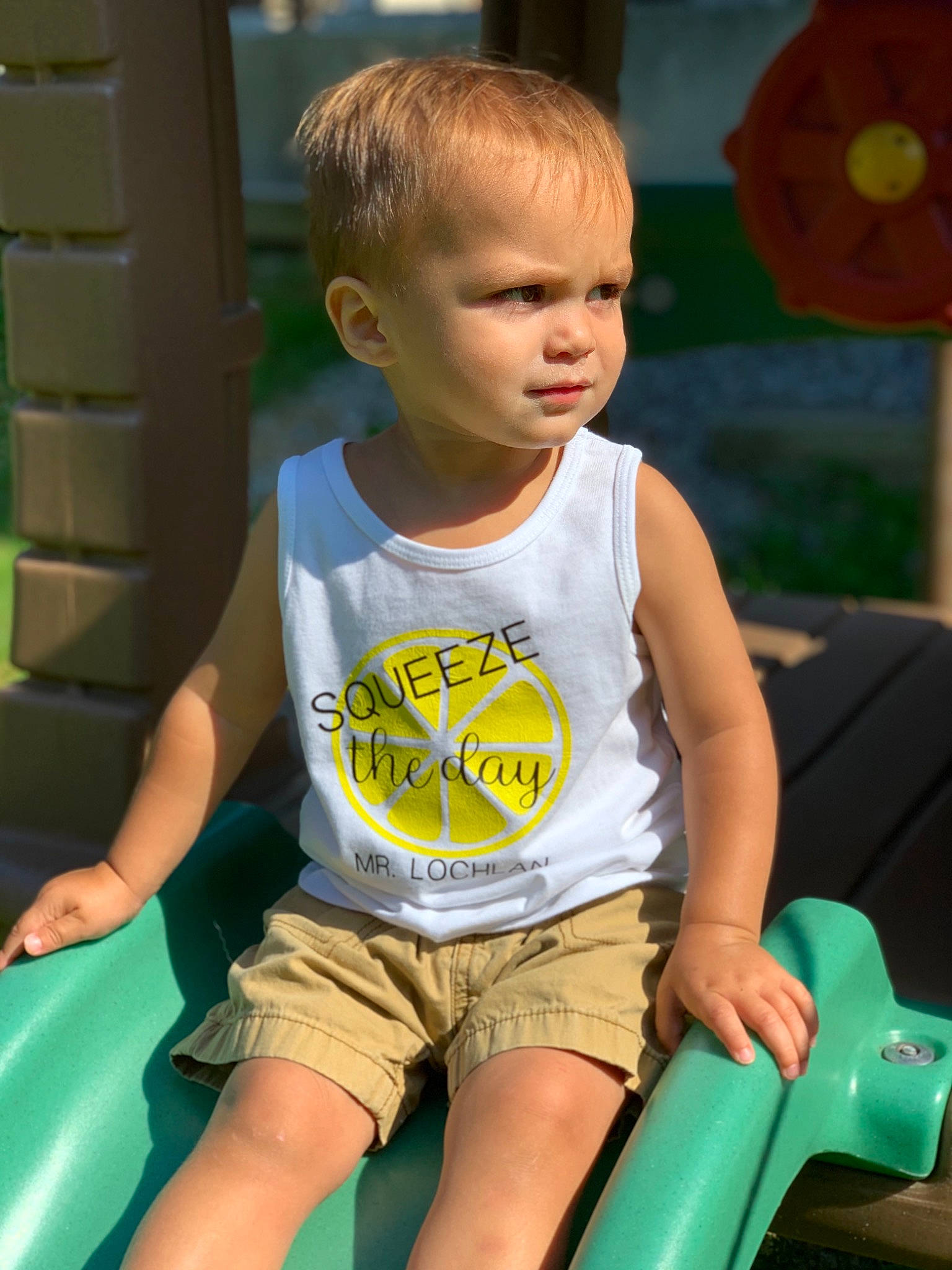 Lochlan is registered to the contest to win money with this photo: child, fun, leg, person, play, playground, public_space, recreation, shorts, sitting, smile, summer, toddler, vacation