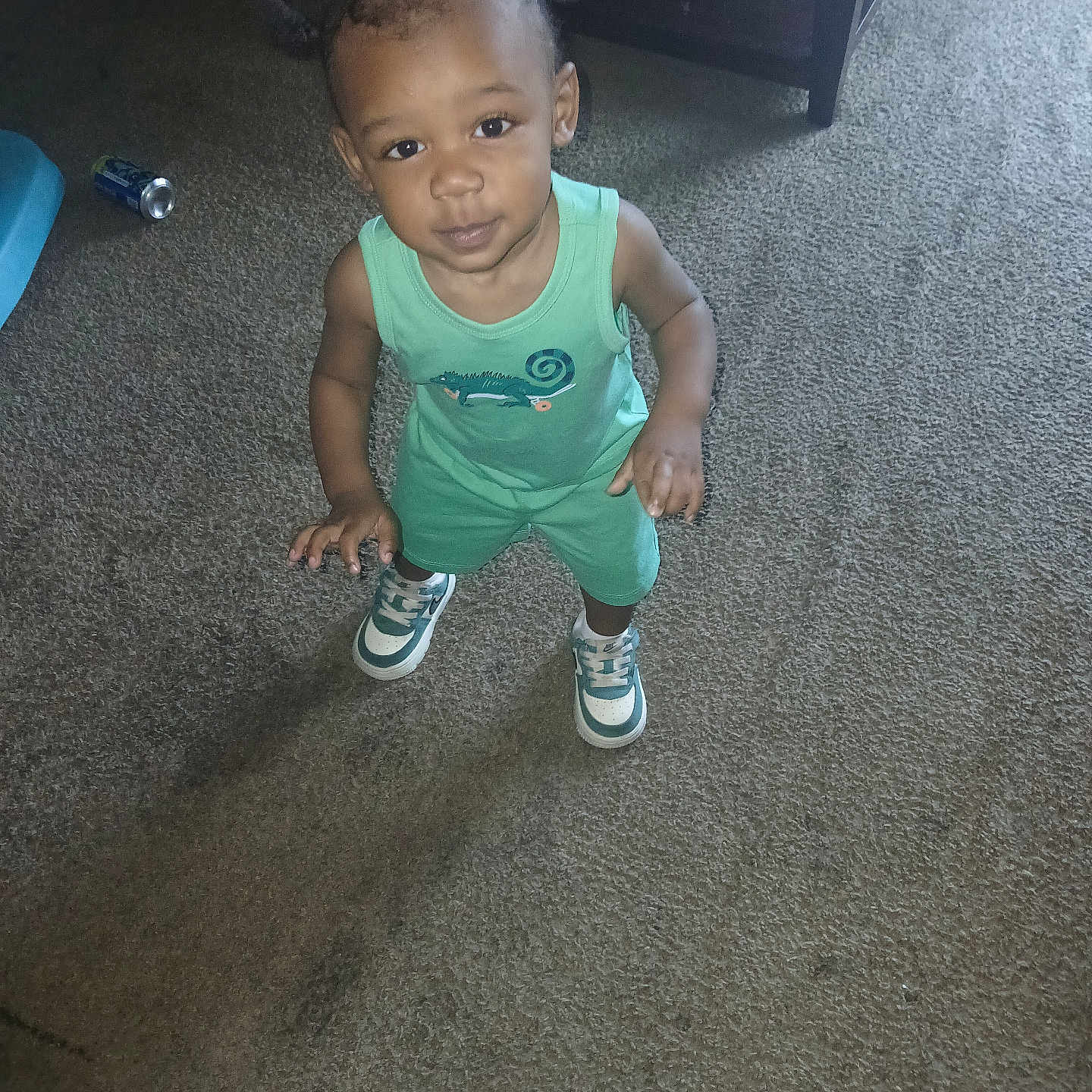Allandrius joined the competition — help win amazing prizes! toddler, child, carpet, green_outfit, sneakers, indoor, person, standing, smile, hair, floor, can, furniture, curious, young_child, looking_up, casual, home, cute, small