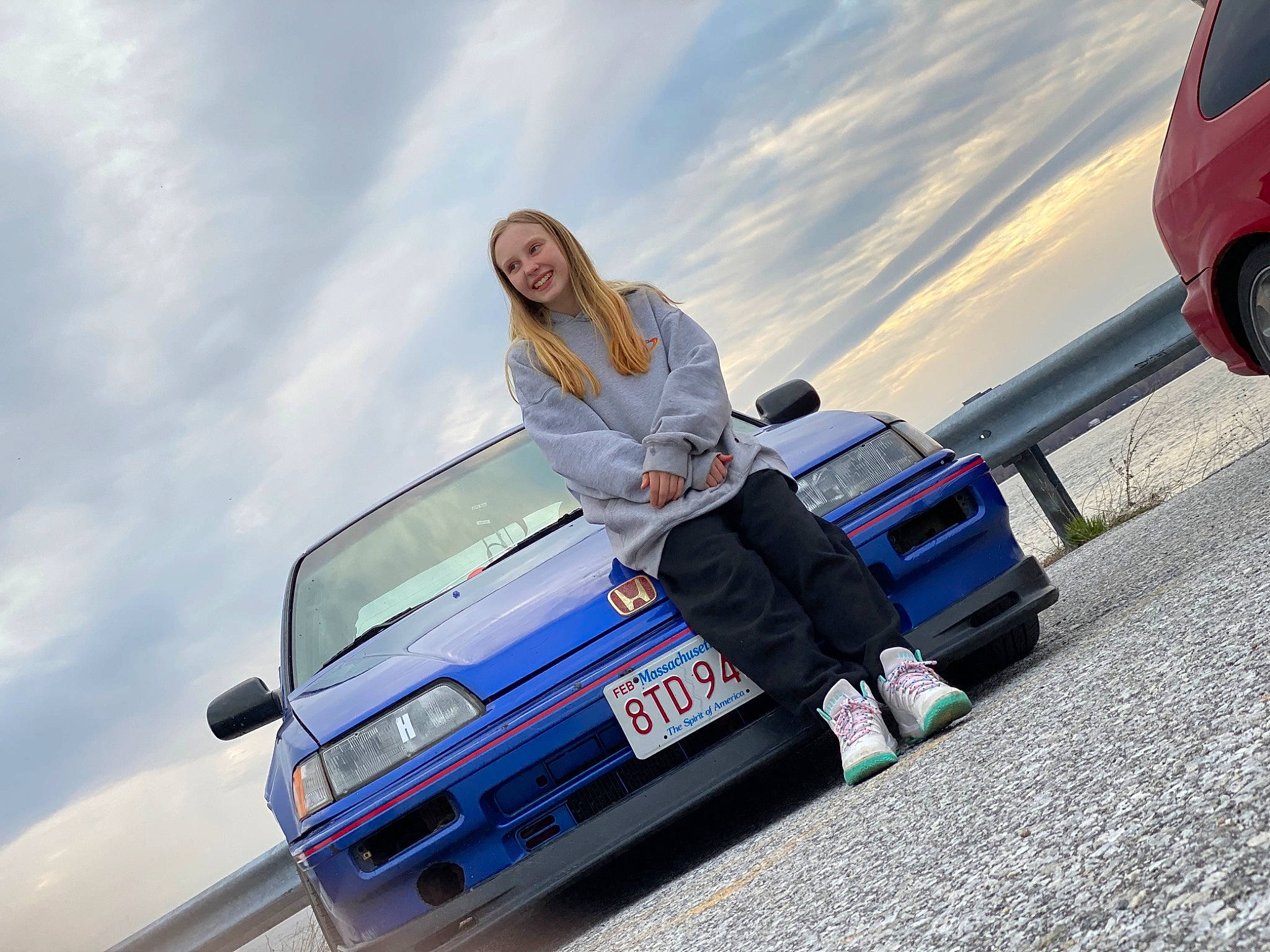 Skylynn is registered to the contest to win money with this photo: automotive_design, automotive_exterior, automotive_lighting, automotive_tire, bumper, car, cloud, flash_photography, hood, jeans, joy, land_vehicle, motor_vehicle, person, rolling, sky, street_fashion, sunglasses, tire, vehicle