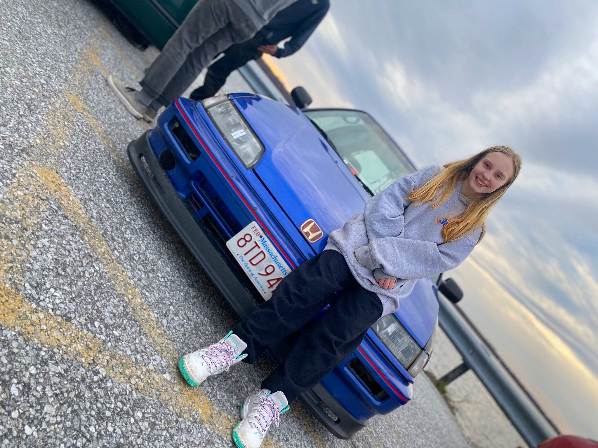 Skylynn joined the competition — help win amazing prizes! asphalt, automotive_design, automotive_exterior, automotive_lighting, automotive_tire, bumper, car, cloud, fender, hood, joy, motor_vehicle, person, personal_luxury_car, rim, rolling, sky, tire, travel, vehicle