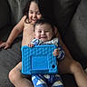 Teegan is registered to the contest to win money with this photo: children, siblings, baby, toddler, smiling, happy, sitting, couch, tablet, toy, indoor, home, portrait, casual, family, barefoot, pajamas, blue, playtime, timestamp
