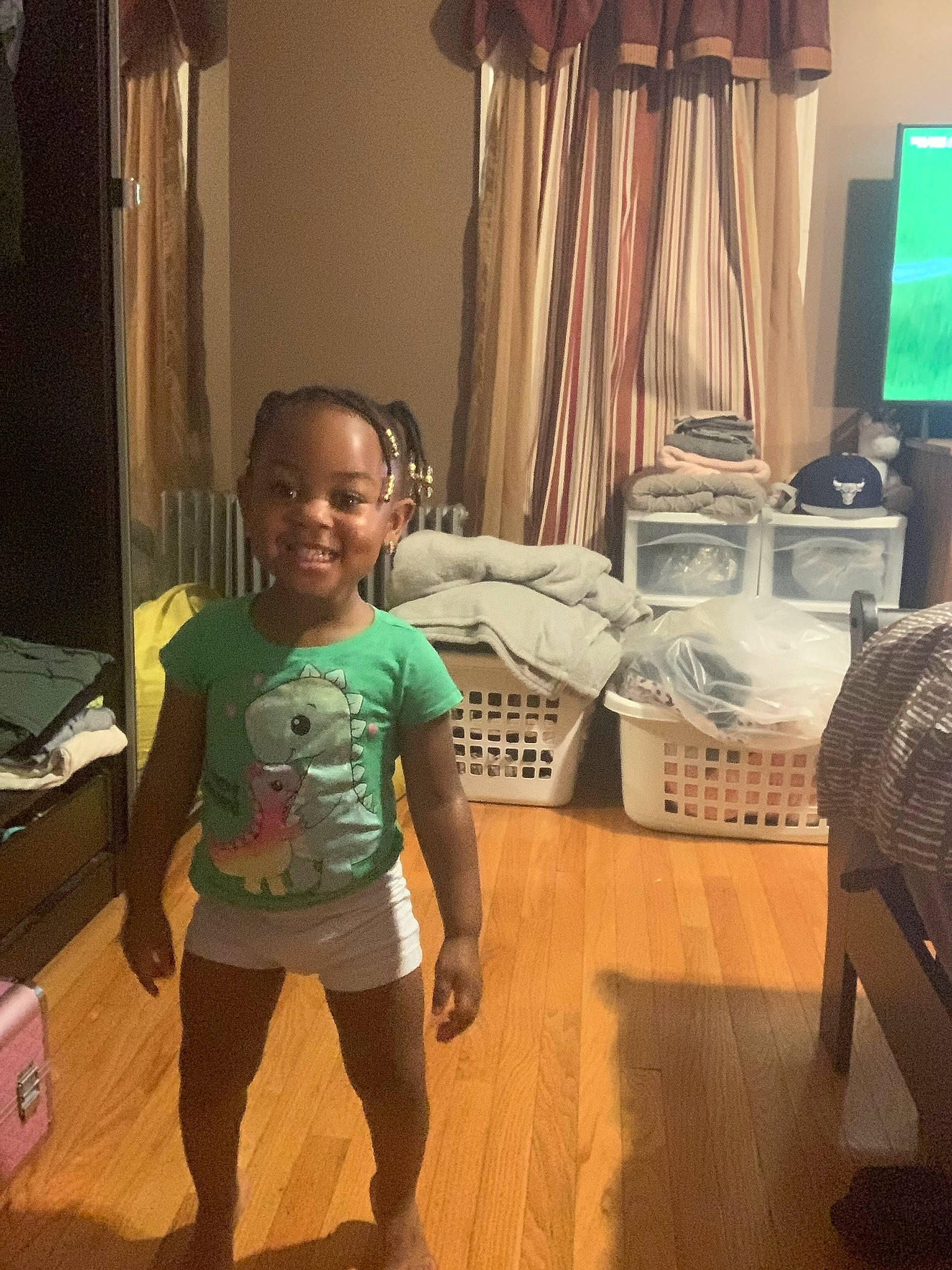 Arya is registered to the contest to win money with this photo: baby, child, curtain, door, floor, flooring, fun, happy, hardwood, house, interior_design, joy, laminate_flooring, living_room, person, room, smile, t_shirt, thigh, toddler