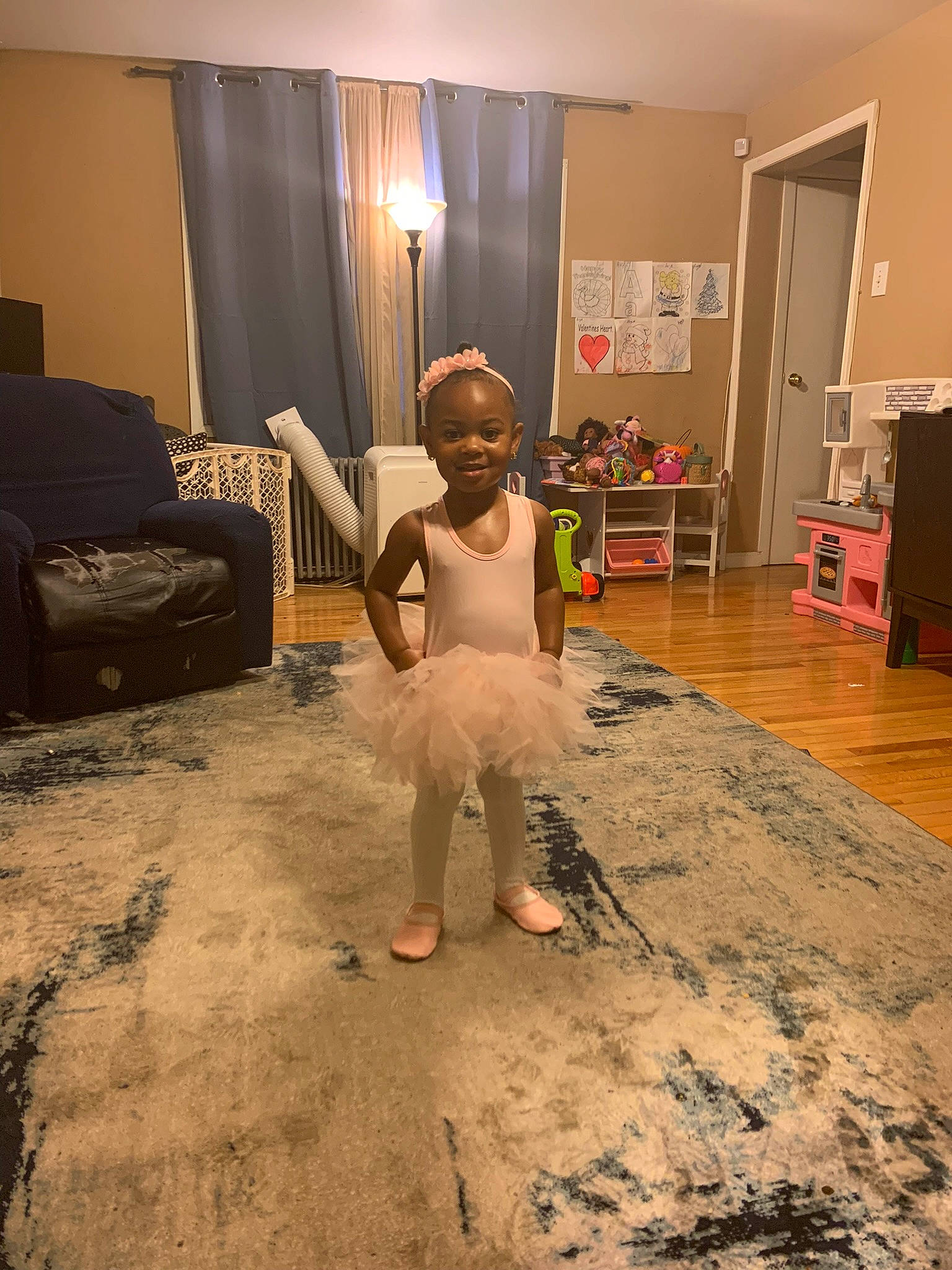 Arya is registered to the contest to win money with this photo: barefoot, child, couch, curtain, event, fashion_design, flash_photography, floor, flooring, foot, fun, happy, hardwood, house, human_leg, joy, living_room, person, sandal, standing