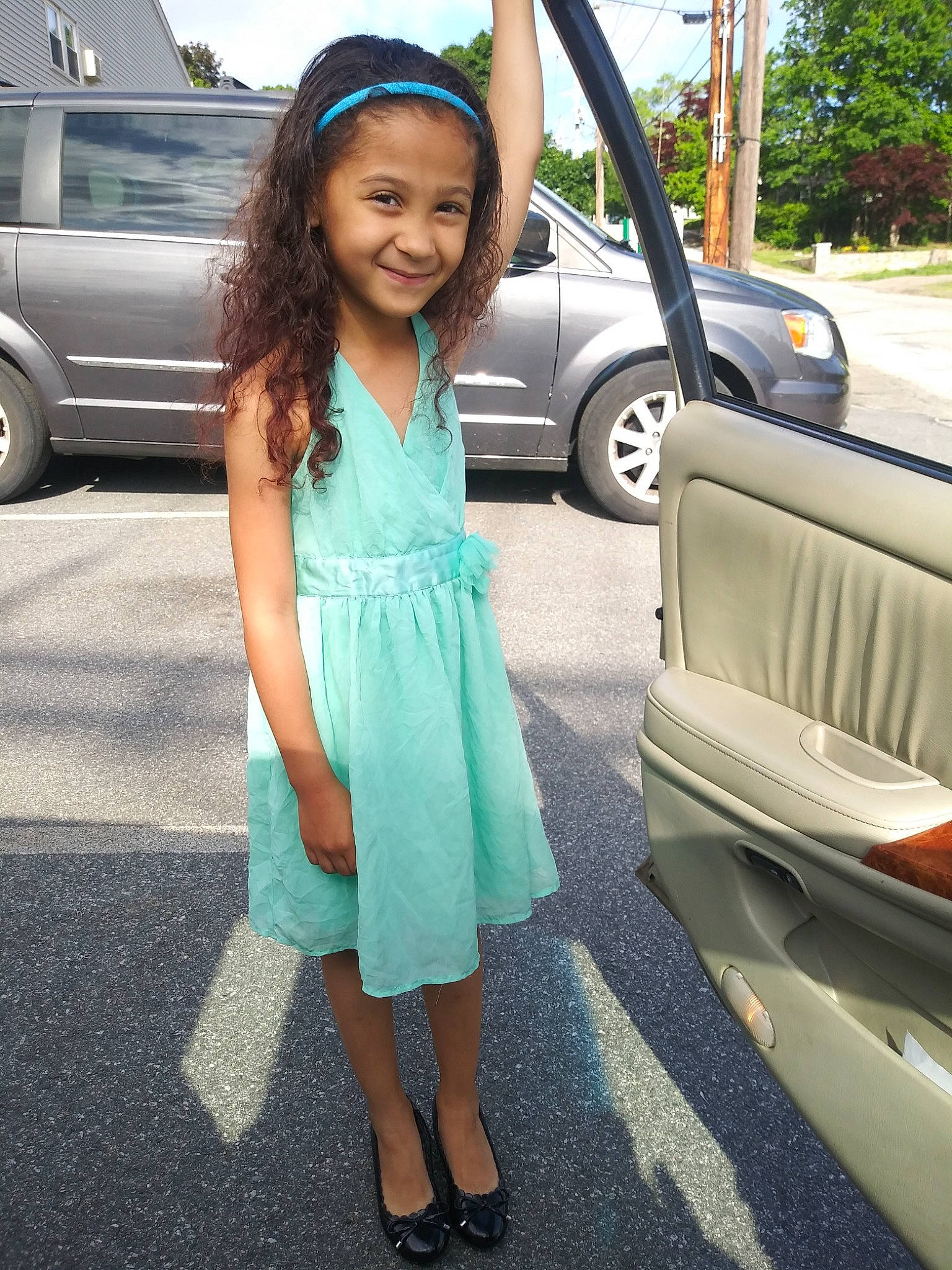 Symphony is registered to the contest to win money with this photo: car, child, clothing, dress, family_car, fashion, footwear, joy, lady, long_hair, luxury_vehicle, motor_vehicle, person, photo_shoot, shoe, smile, street_fashion, summer, turquoise, vacation