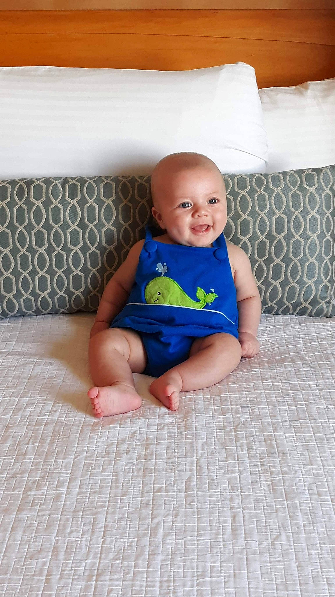 Brody is registered to the contest to win money with this photo: baby, baby_toddler_clothing, blue, child, floor, flooring, joy, leg, person, play, product, sitting, skin, smile, toddler, vacation