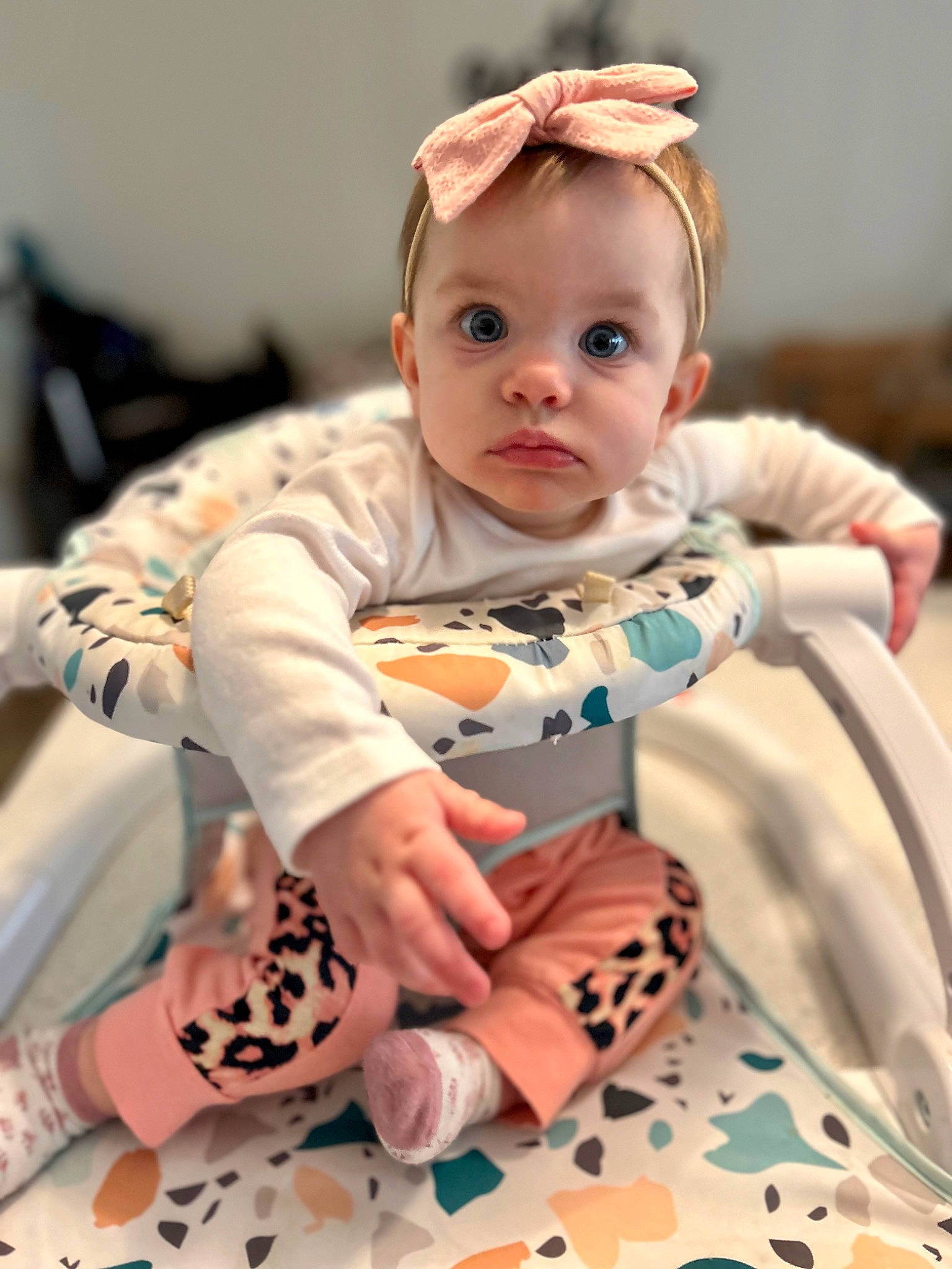Elysia joined the competition — help win amazing prizes! baby, baby_toddler_clothing, cheek, child, event, eye, facial_expression, fun, happy, human, human_body, mammal, orange, organ, people, person, pink, sitting, skin, sleeve