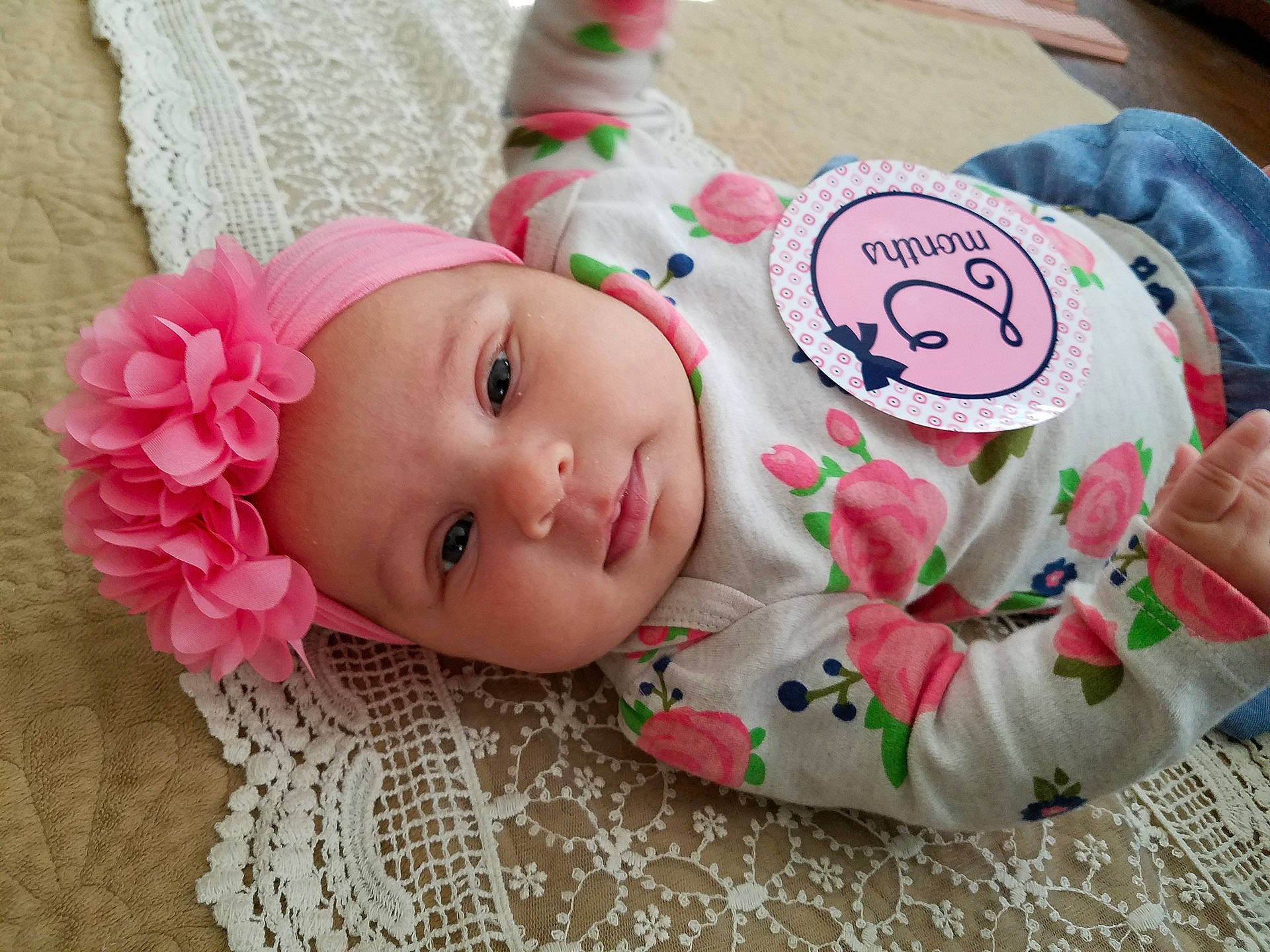 Danika is registered to the contest to win money with this photo: baby_products, cheek, child, girl, hair_accessory, infant, person, petal, pink, product, skin, smile, textile, toddler
