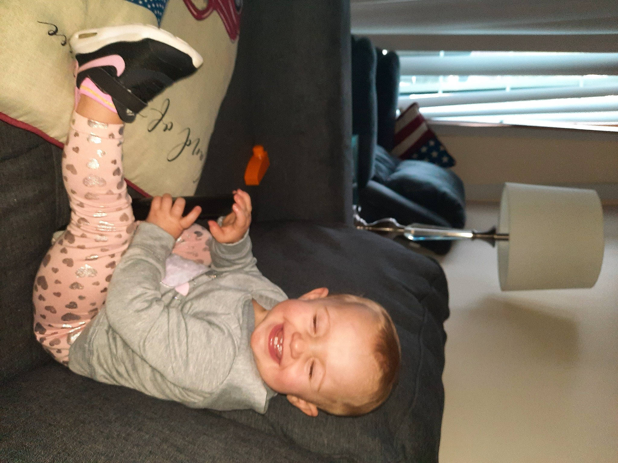 Melania is registered to the contest to win money with this photo: auto_part, carmine, chair, child, comfort, elbow, flooring, fun, gesture, joint, joy, nail, person, room, sitting, sneakers, sock, suit, t_shirt, tire