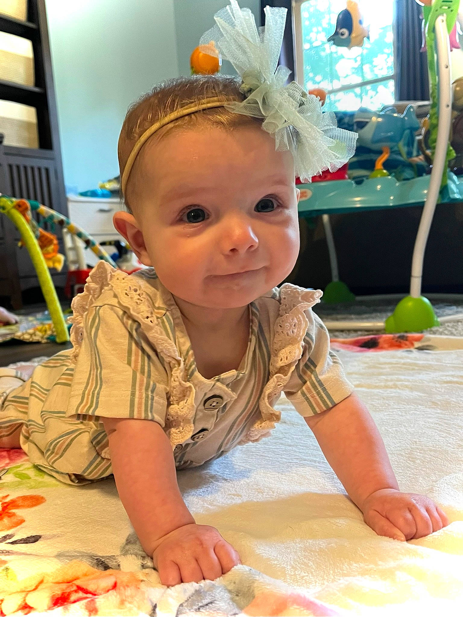 Casey is registered to the contest to win money with this photo: baby, baby_toddler_clothing, child, event, flooring, fun, happy, leisure, party, party_supply, person, play, sitting, summer, toddler, vacation, yellow