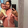 Lehlani is registered to the contest to win money with this photo: baby, child, woman, selfie, mirror, hoodie, phone, indoor, curly_hair, holding, pink, yellow, socks, window, curtain, face, portrait, casual, expression, skin