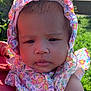 Lehlani joined the competition — help win amazing prizes! baby, child, face, floral, bonnet, outdoor, greenery, sunlight, person, infant, clothing, cute, skin, portrait, headwear, nature, summer, holding, expression, closeup