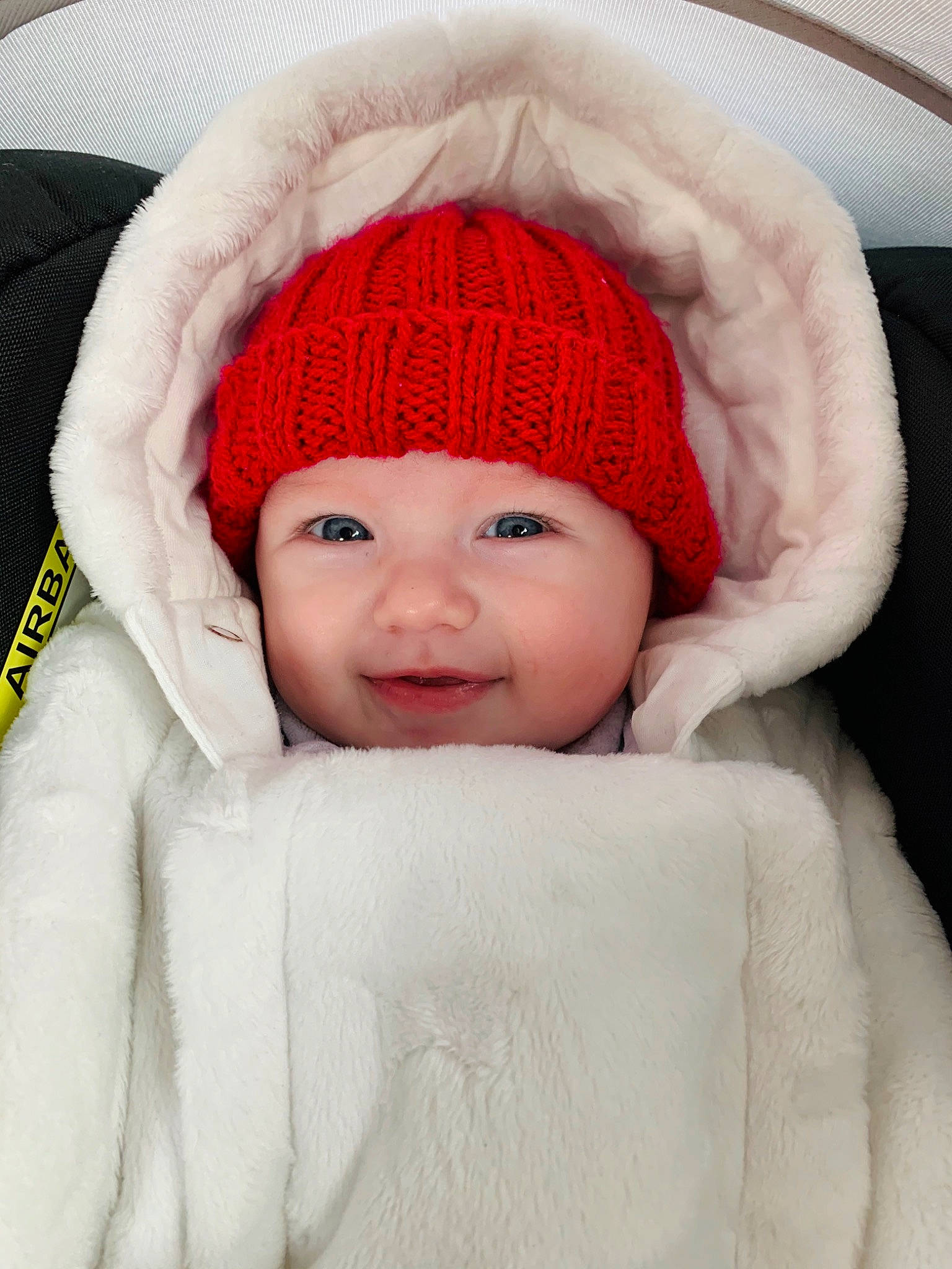 Elisa joined the competition — help win amazing prizes! baby, beanie, bonnet, cap, cheek, child, clothing, fur, head, headgear, knit_cap, person, skin, toddler, wool