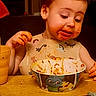 Ian joined the competition — help win amazing prizes! toddler, child, messy, spaghetti, food, bib, table, cup, bowl, face, hands, meal, dinner, indoor, curious, sitting, cute, young_child, eating, kitchen