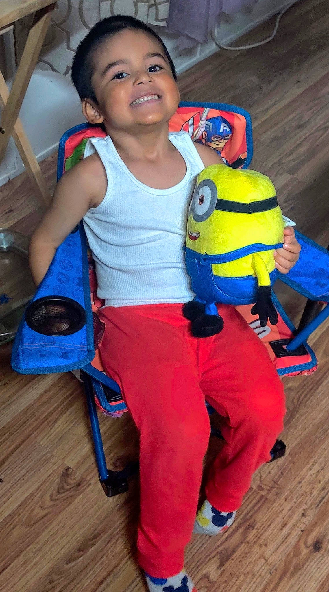 Gianni is registered to the contest to win money with this photo: backpack, bag, blue, child, electric_blue, fun, happy, joint, joy, leisure, luggage_and_bags, person, personal_protective_equipment, recreation, shoe, shorts, smile, sportswear, standing, sweatpant