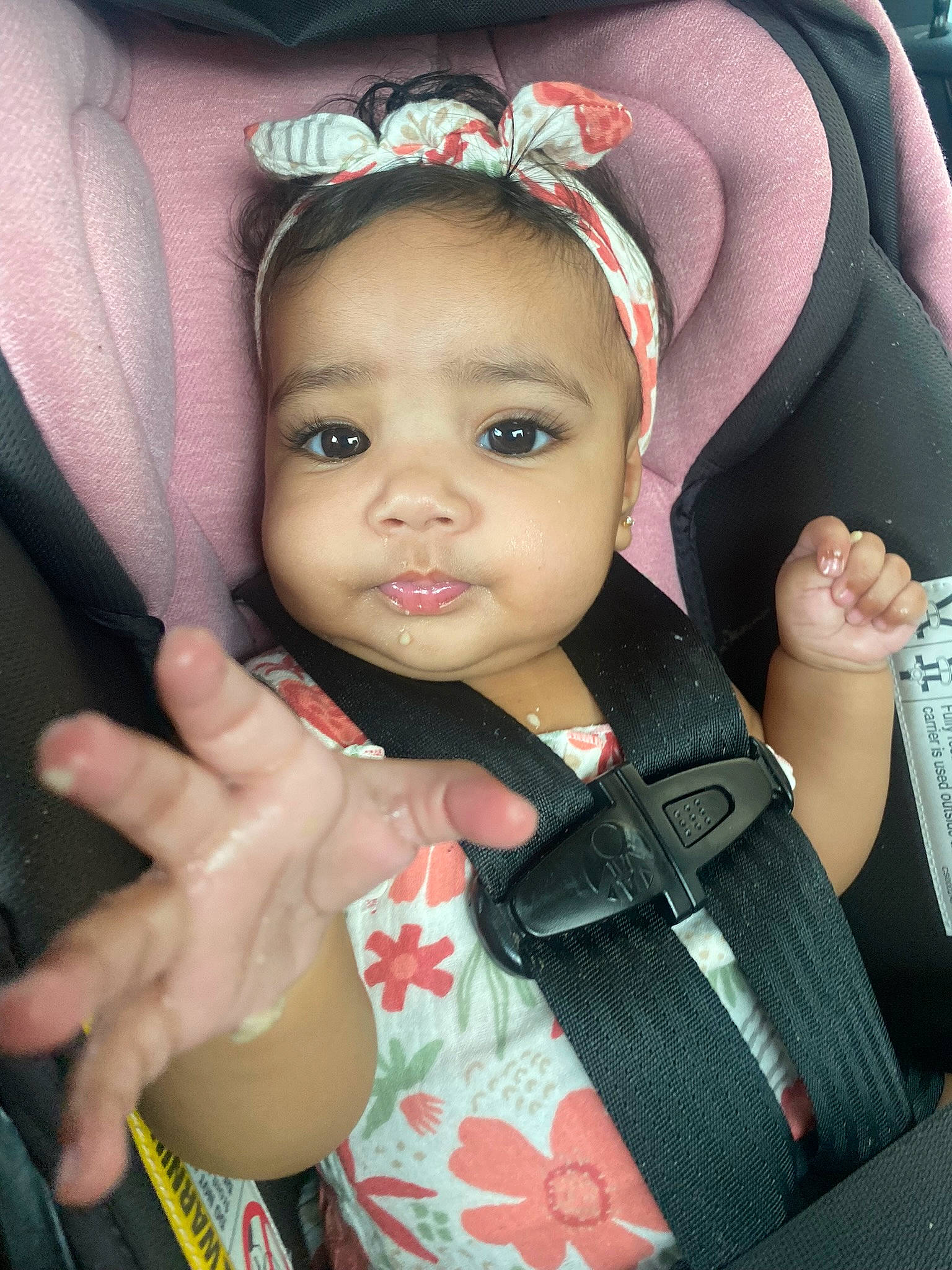 Emelia is registered to the contest to win money with this photo: arm, baby_toddler_clothing, cap, cheek, chin, eye, eyebrow, eyelash, face, facial_expression, finger, gesture, hairstyle, hand, happy, iris, lip, person, product, skin