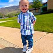 Alexander joined the competition — help win amazing prizes! child, boy, smiling, outdoor, sunny_day, blue_sky, clouds, grass, tree, mountains, sidewalk, shirt, jeans, sneakers, happy, portrait, casual_clothing, standing, hair, daylight