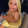 Ethan participe au concours pour gagner de l'argent avec cette photo : toddler, child, bathroom, towel, yellow_towel, toy_car, blue_toy, cute, baby, sitting, indoors, skin, face, eyes, hands, comfort, bath, play, cushion, tile_wall