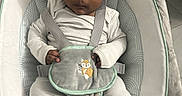 Jaevion is registered to the contest to win money with this photo: baby, infant, child, portrait, bouncer, baby_seat, hat, beanie, striped_outfit, harness, plush_toy, owl_toy, slippers, animal_slippers, cushion, blanket, indoors, sitting, serious_expression, safe_sleep_space