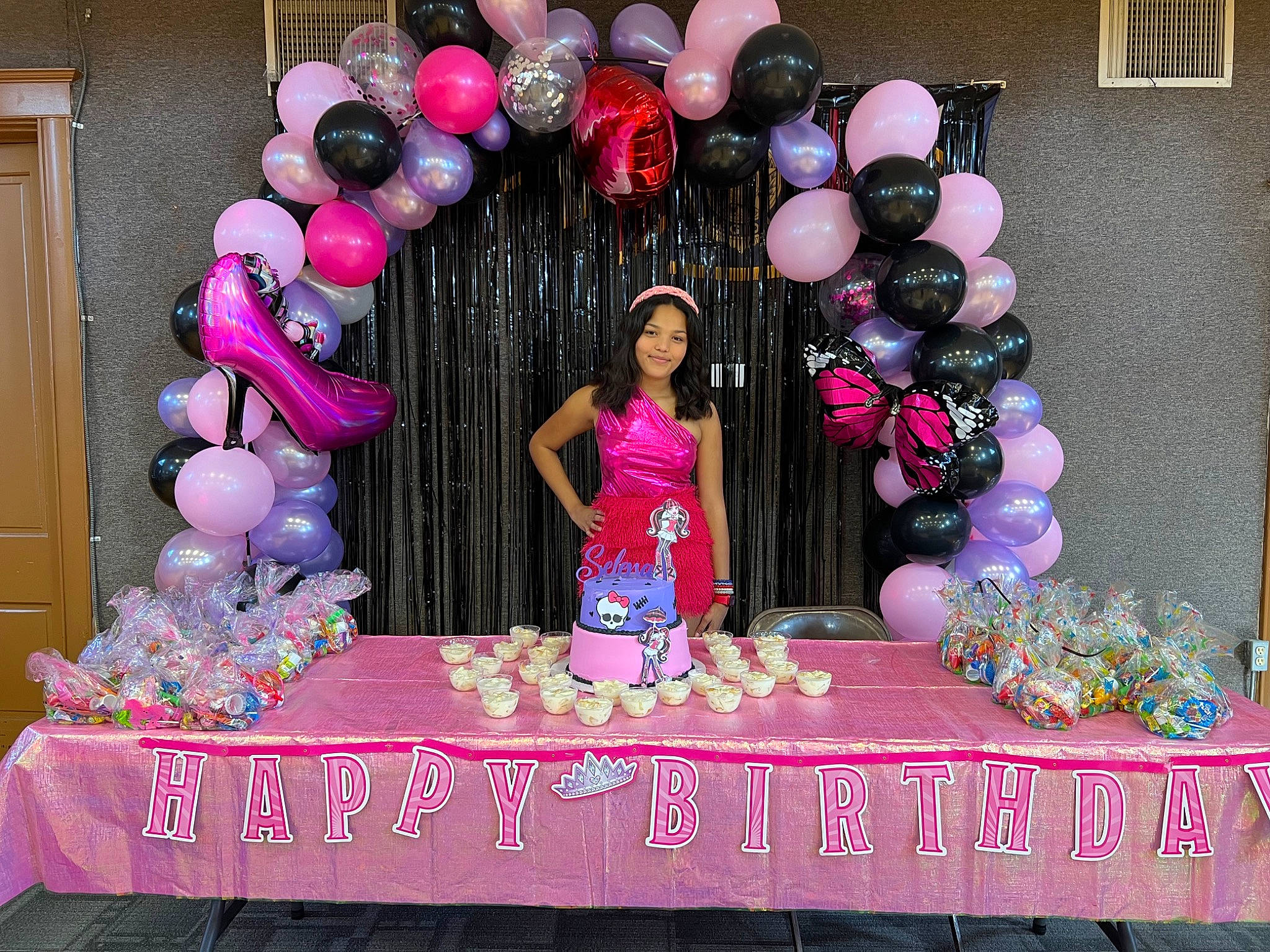 Selena is registered to the contest to win money with this photo: arch, balloon, birthday_party, decoration, door, event, fun, happy, joy, linens, magenta, party, party_supply, peach, person, pink, sweetness, table, tablecloth, textile