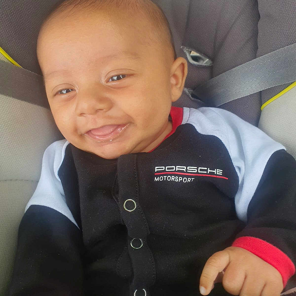 Kendal participe au concours pour gagner de l'argent avec cette photo : accessories, baby, belt, bodypart, clothing, coat, cushion, face, happy, head, homedecor, jacket, laughing, mouth, pants, person, photography, portrait, smile, teeth