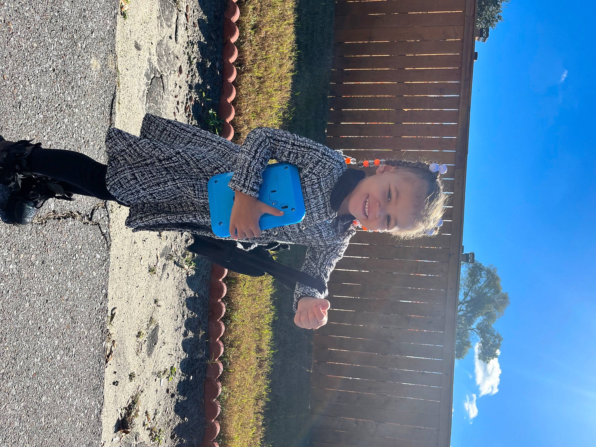 Armani is registered to the contest to win money with this photo: azure, blue, city, daytime, denim, electric_blue, fun, happy, joy, leisure, pattern, people_in_nature, person, road_surface, shadow, sky, tints_and_shades, toddler, travel, walking_shoe