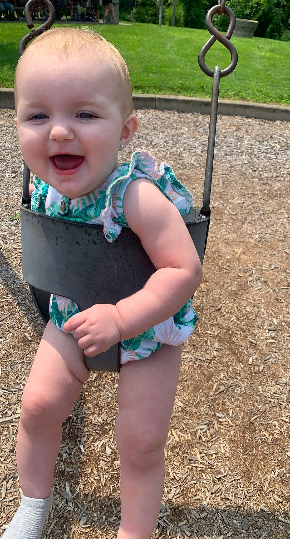Madalyn is registered to the contest to win money with this photo: baby, baby_toddler_clothing, blond, cheek, child, electric_blue, eye, fun, grass, happy, human_leg, leisure, people_in_nature, person, public_space, skin, sleeve, smile, standing, thigh