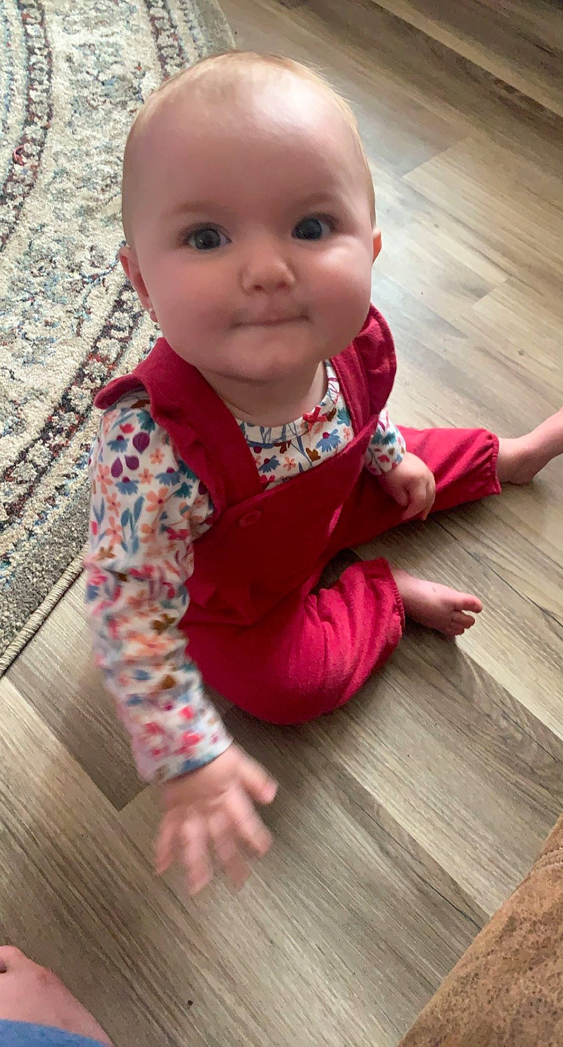 Madalyn joined the competition — help win amazing prizes! baby, baby_toddler_clothing, cheek, chin, finger, floor, flooring, happy, hardwood, nose, person, pink, red, skin, sleeve, smile, standing, toddler, varnish, wood