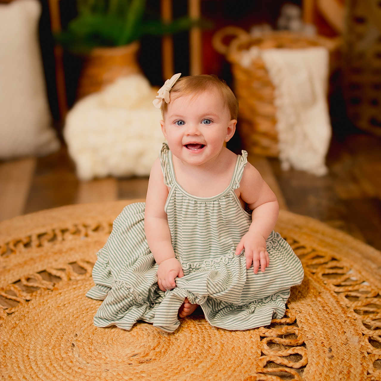 Adelaide is registered to the contest to win money with this photo: baby, bodypart, clothing, dress, face, finger, hand, happy, hardwood, head, homedecor, laughing, pants, person, photography, portrait, rug, sitting, smile, wood