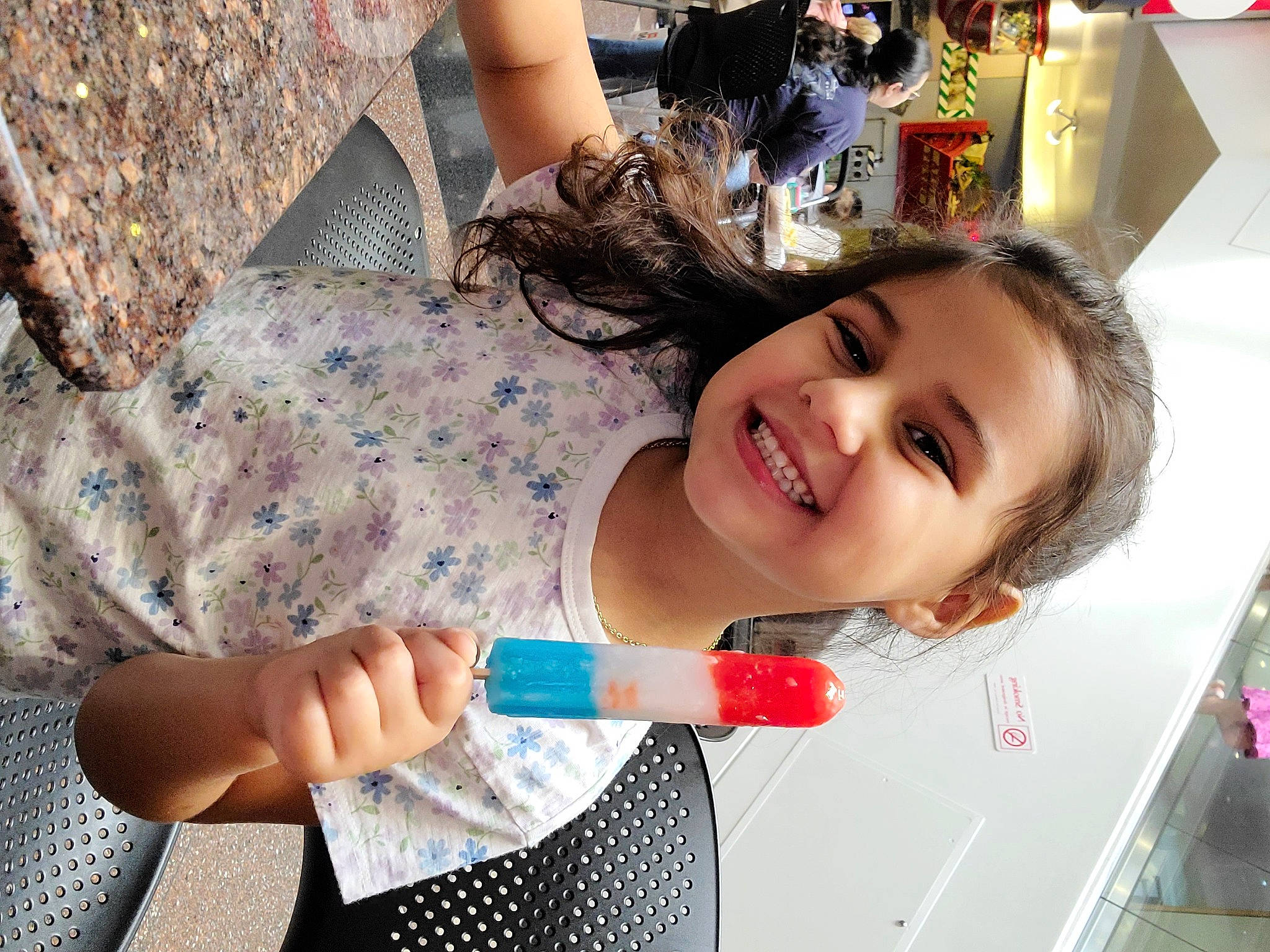 Eleanor is registered to the contest to win money with this photo: child, dress, event, eyelash, finger, fun, grass, happy, human_leg, joy, leisure, mouth, nail, pattern, person, play, skin, smile, summer, thigh