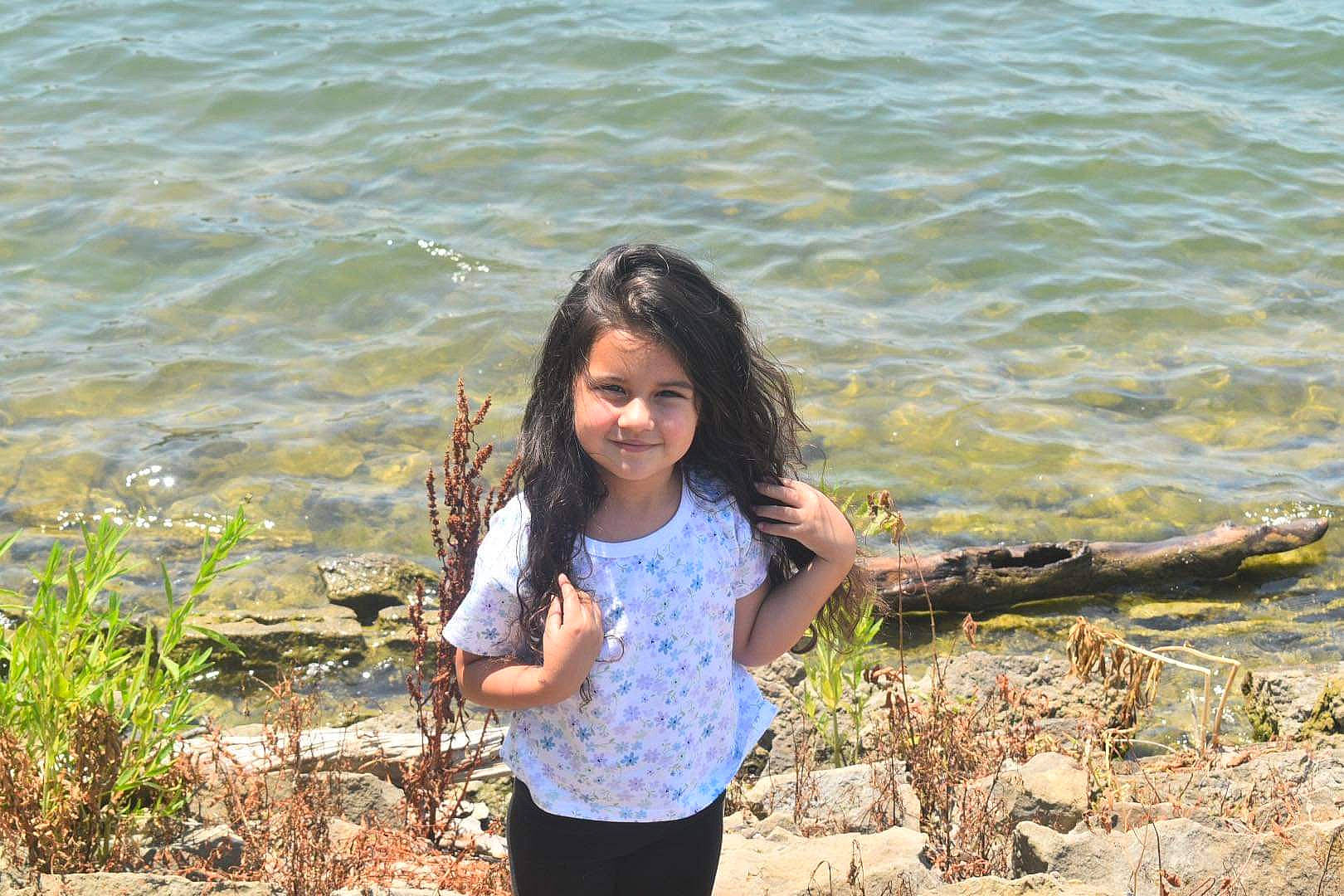 Eleanor joined the competition — help win amazing prizes! azure, bank, coastal_and_oceanic_landforms, face, fawn, fun, grass, happy, joy, lake, leisure, mammal, people_in_nature, person, plant, smile, summer, sunglasses, vegetation, vertebrate