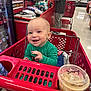 Banks joined the competition — help win amazing prizes! baby, shopping_cart, store, checkout, smiling, green_clothing, cup, lid, food, customer, cashier, retail, indoor, person, happy, shopping, floor, red, plastic, seat
