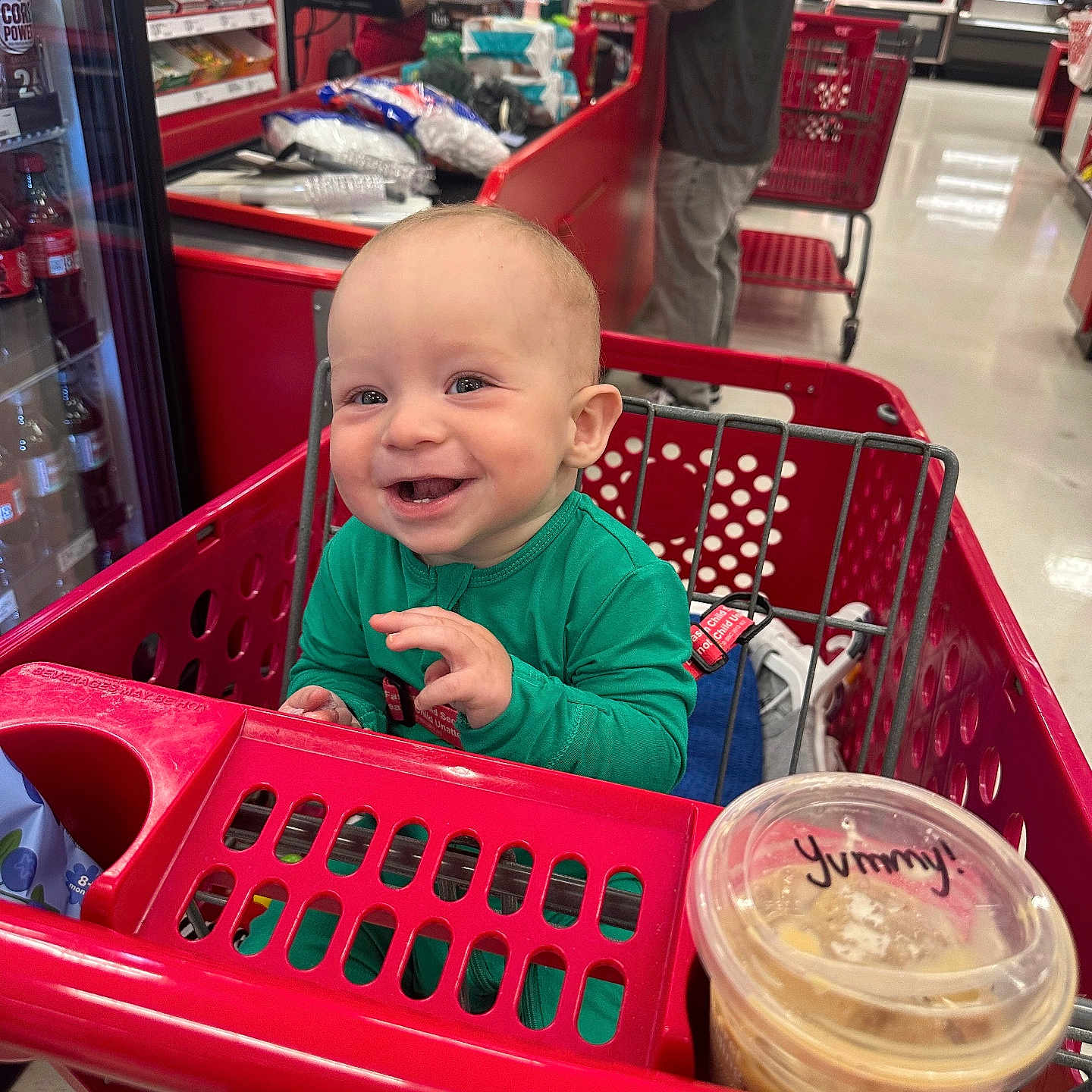 Banks joined the competition — help win amazing prizes! baby, cashier, checkout, cup, customer, floor, food, green_clothing, happy, indoor, lid, person, plastic, red, retail, seat, shopping, shopping_cart, smiling, store