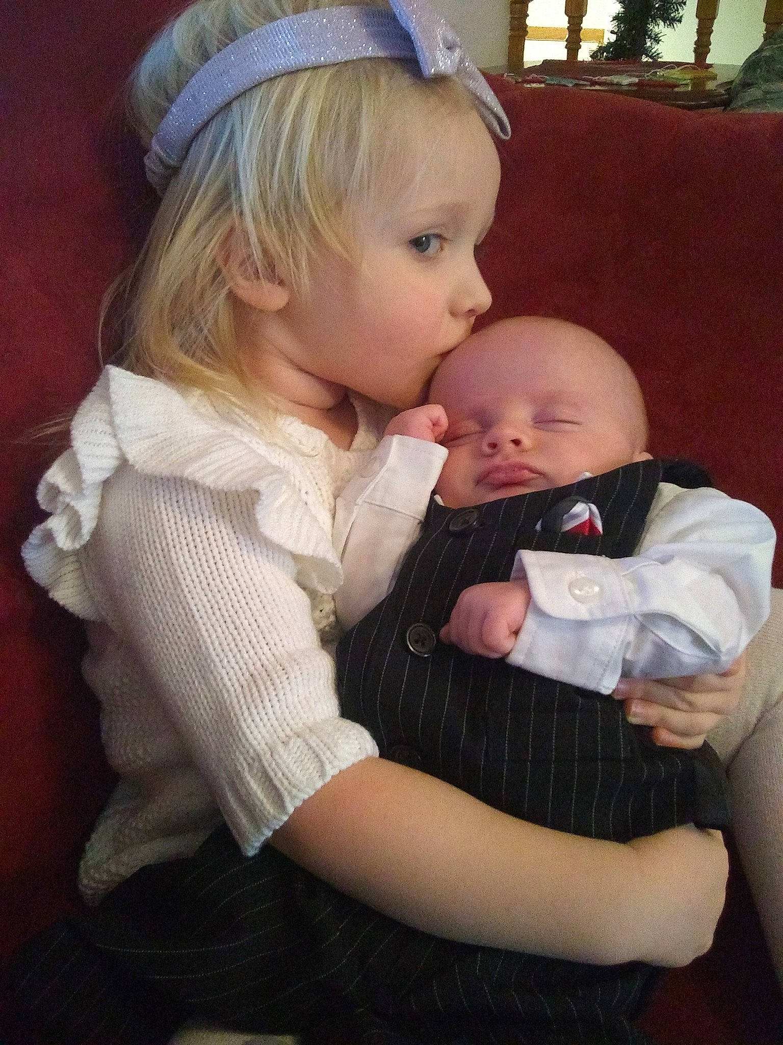 Bryce joined the competition — help win amazing prizes! baby_products, child, daughter, day, girl, hair_accessory, headgear, human_hair_color, infant, iris, lap, mother, person, product, skin, textile, toddler