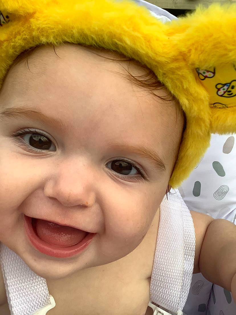 Winter-gray is registered to the contest to win money with this photo: baby, baby_toddler_clothing, cheek, child, close_up, event, eyelash, facial_expression, fun, fur, gesture, happy, iris, joy, lip, nose, person, plush, skin, smile