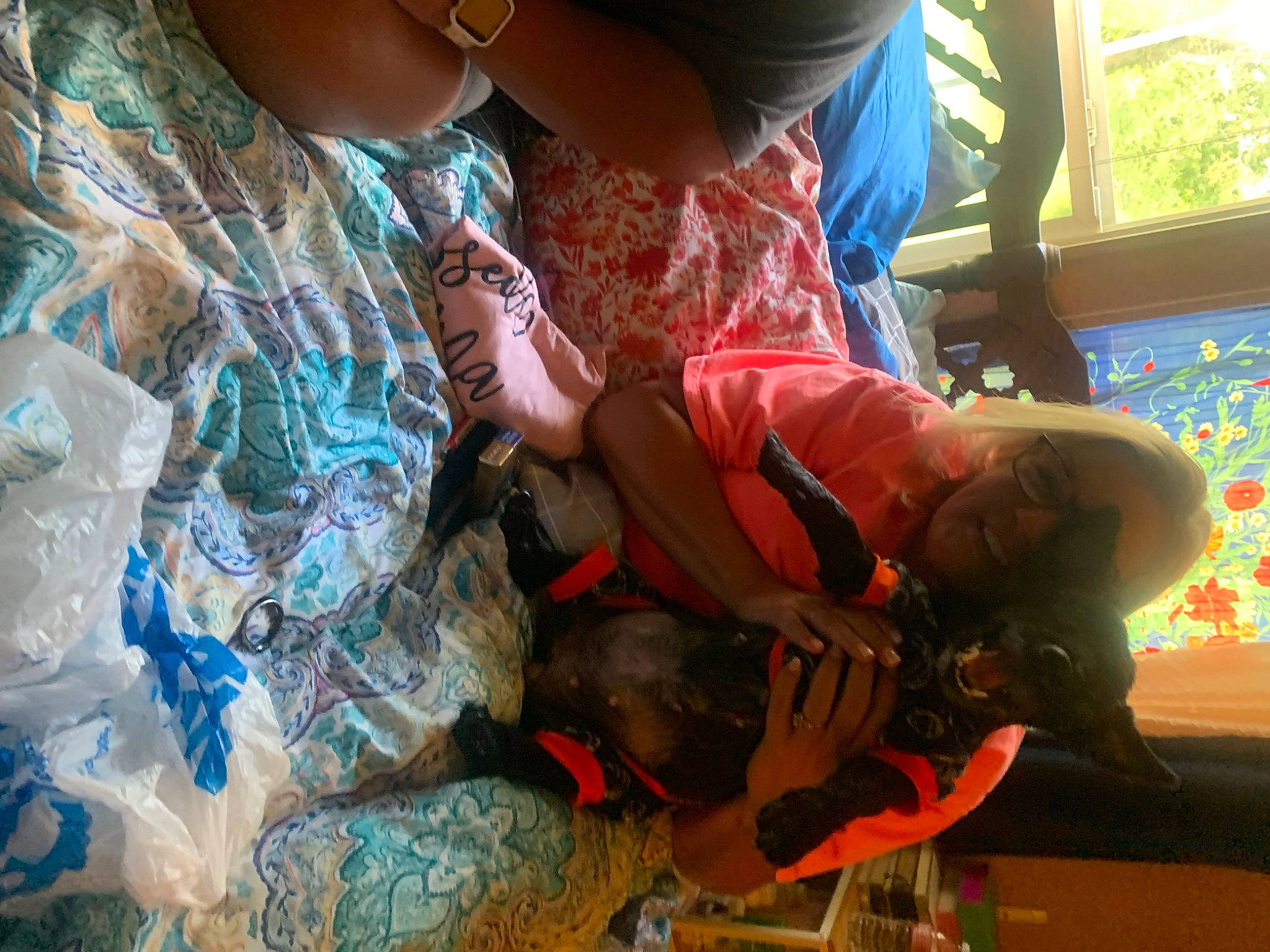 Lady is registered to the contest to win money with this photo: arm, boot, child, eyewear, fun, grass, hat, human_leg, leisure, pattern, personal_protective_equipment, recreation, sandal, service, shorts, soil, sunglasses, t_shirt, tree, visual_arts