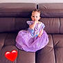 animated_character, casual, child, couch, curious, cute, dress, furniture, heart_emoji, home, indoor, leather, person, portrait, purple, sitting, smile, thumb_sucking, toddler, young_child