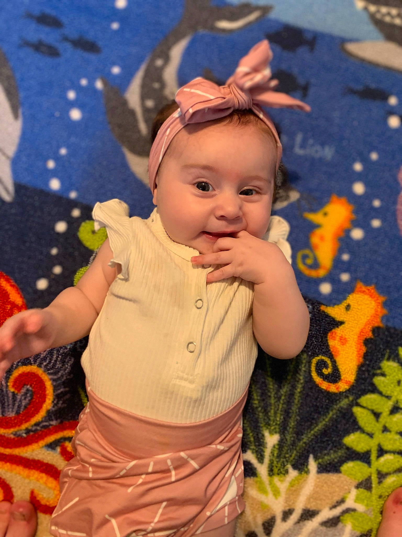 Adelina is registered to the contest to win money with this photo: art, baby, baby_toddler_clothing, beauty, cheek, child, event, facial_expression, flooring, fun, grass, happy, human, human_body, pattern, people_in_nature, person, plant, sitting, skin