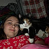 Nymeria is registered to the contest to win money with this photo: bed, bedding, blanket, calico_cat, cat, cozy, cuddling, domestic_animal, floral_pattern, indoors, lying_down, pajamas, person, pet, pillow, plaid, portrait, relaxed, selfie, sleepy