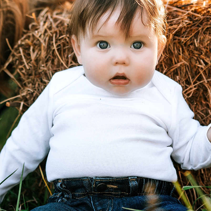 Atticus joined the competition — help win amazing prizes! baby, bodypart, clothing, countryside, face, finger, frown, hand, happy, head, jeans, nature, outdoors, pants, person, photography, portrait, sitting, smile, straw