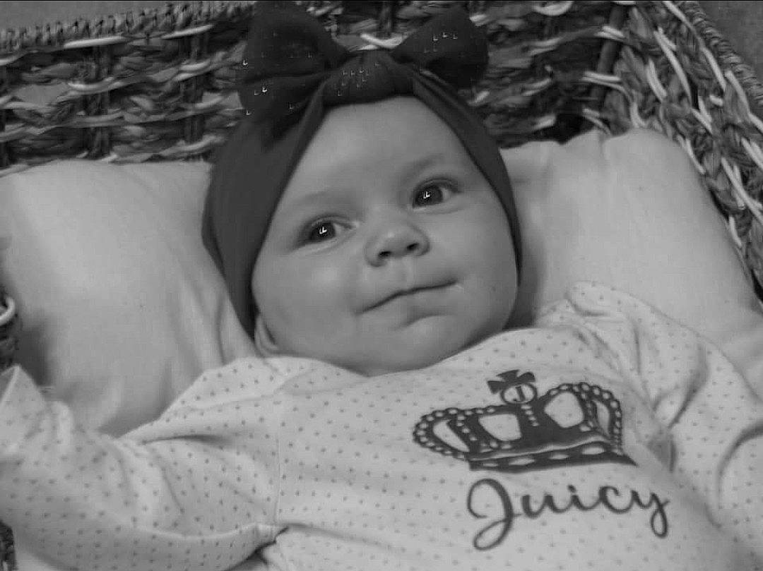 Alora is registered to the contest to win money with this photo: baby, baby_toddler_clothing, black, black_and_white, cheek, child, chin, comfort, eyebrow, flash_photography, happy, headwear, iris, monochrome_photography, nose, organ, person, skin, sleeve, smile