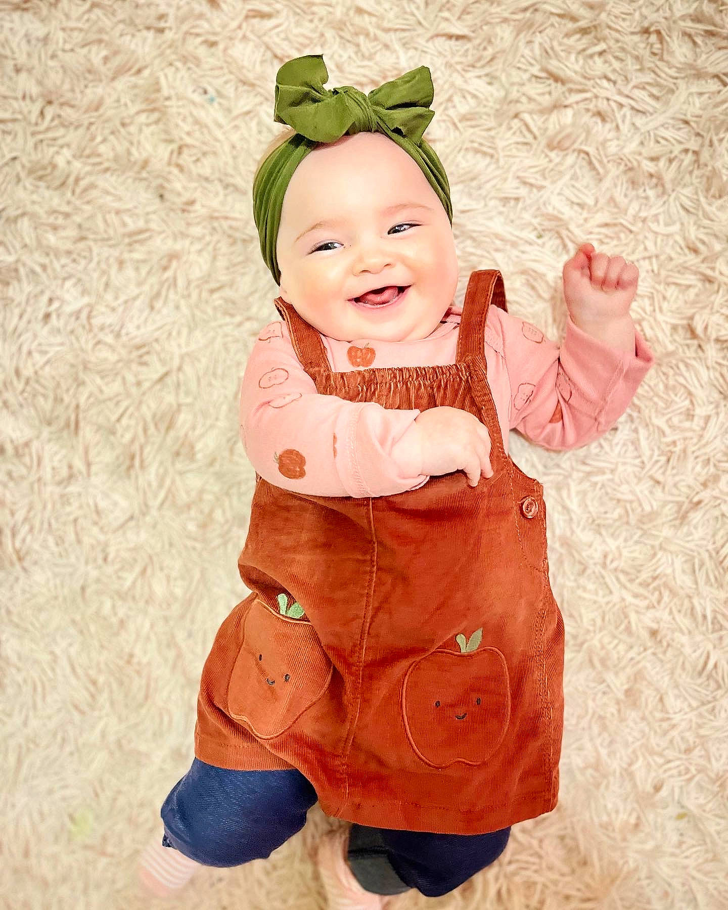 Fiona is registered to the contest to win money with this photo: baby, baby_toddler_clothing, cheek, child, costume, costume_hat, fictional_character, finger, fun, gesture, happy, head, joy, pattern, peach, people_in_nature, person, sitting, skin, sleeve