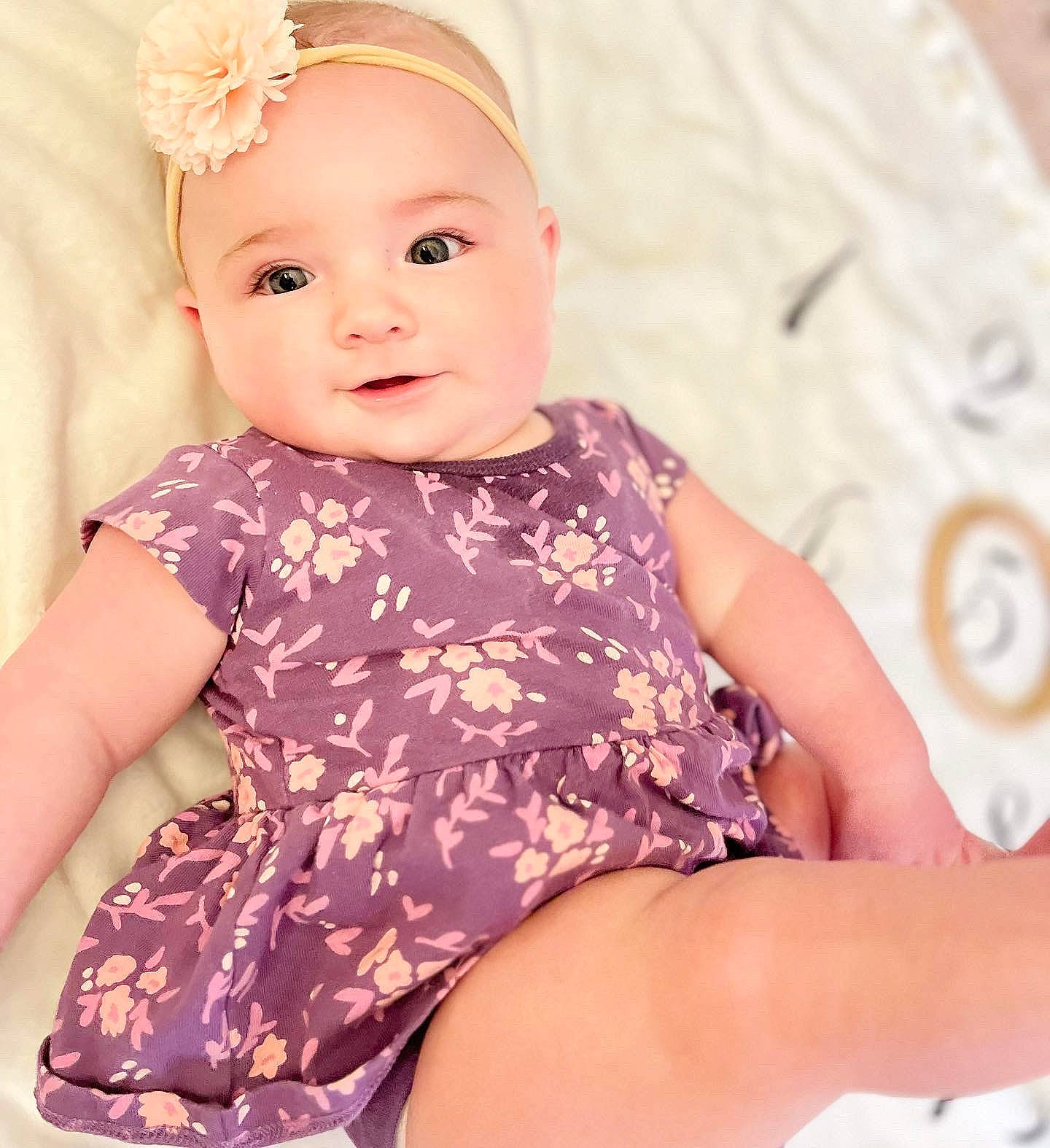Fiona is registered to the contest to win money with this photo: arm, baby, baby_toddler_clothing, cheek, embellishment, eye, eyelash, face, hairstyle, happy, head, iris, neck, pattern, person, pink, skin, sleeve, smile, thigh