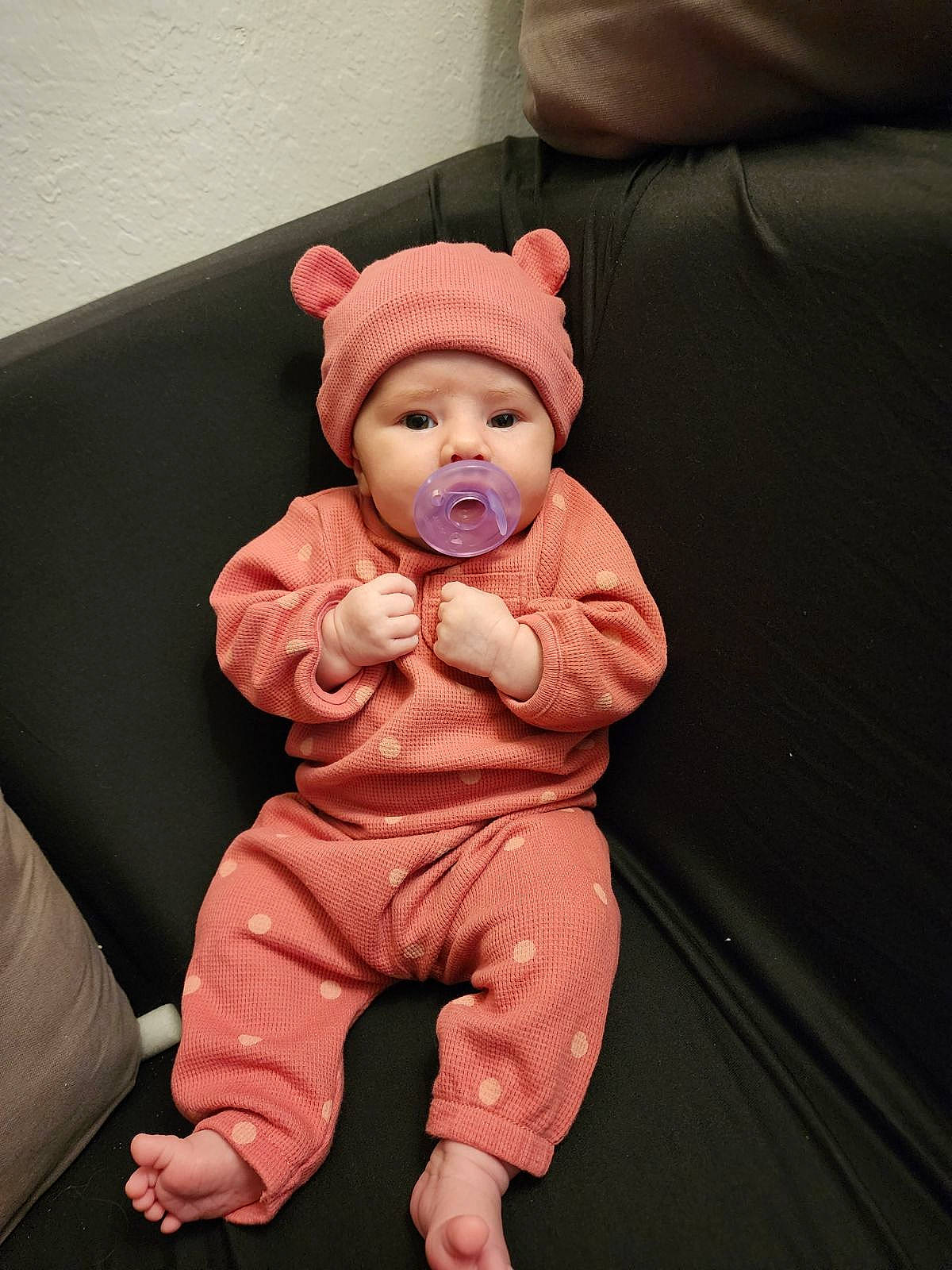 Noemy joined the competition — help win amazing prizes! baby, baby_toddler_clothing, beanie, cheek, child, comfort, couch, fictional_character, finger, flooring, foot, headwear, human_body, human_leg, linens, peach, person, room, sitting, sleeve