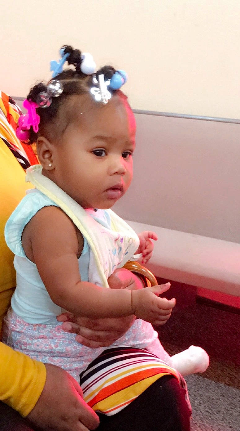 Alaya Agent is registered to the contest to win money with this photo: baby, child, ear, hair_accessory, headband, person, pink, play, sitting, skin, toddler