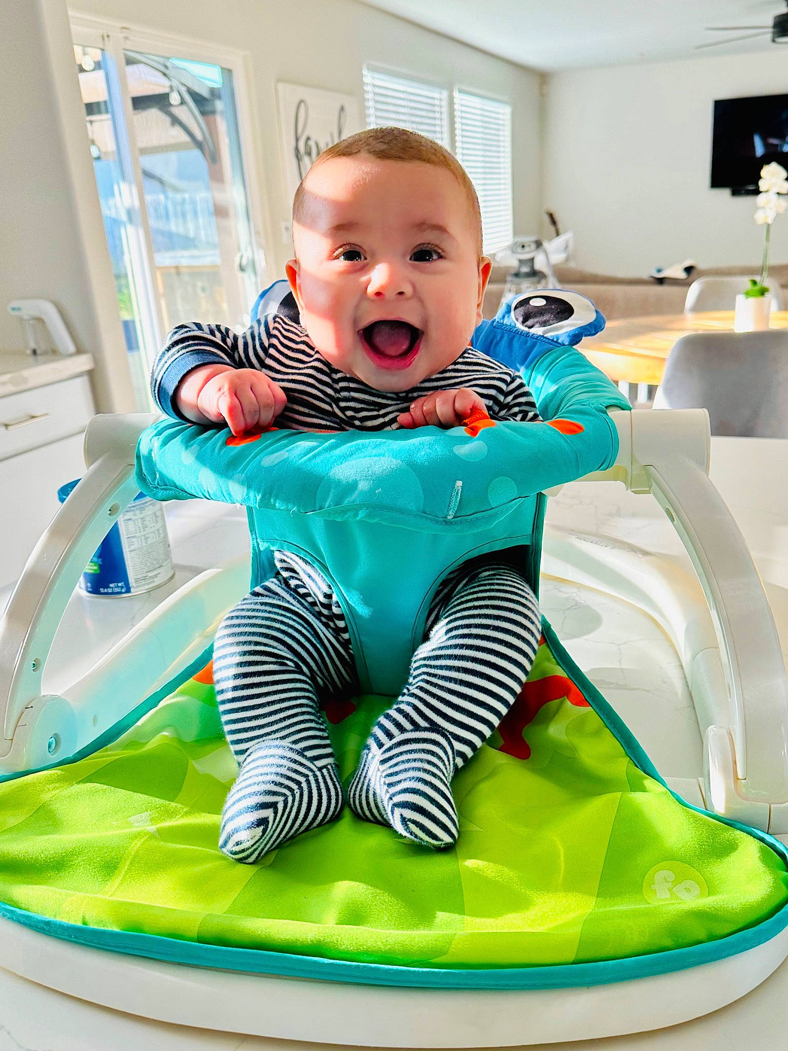 Caleb joined the competition — help win amazing prizes! aqua, baby, baby_products, baby_safety, baby_toddler_clothing, child, comfort, electric_blue, fun, happy, leisure, person, personal_protective_equipment, play, product, sitting, sleeve, smile, t_shirt, textile