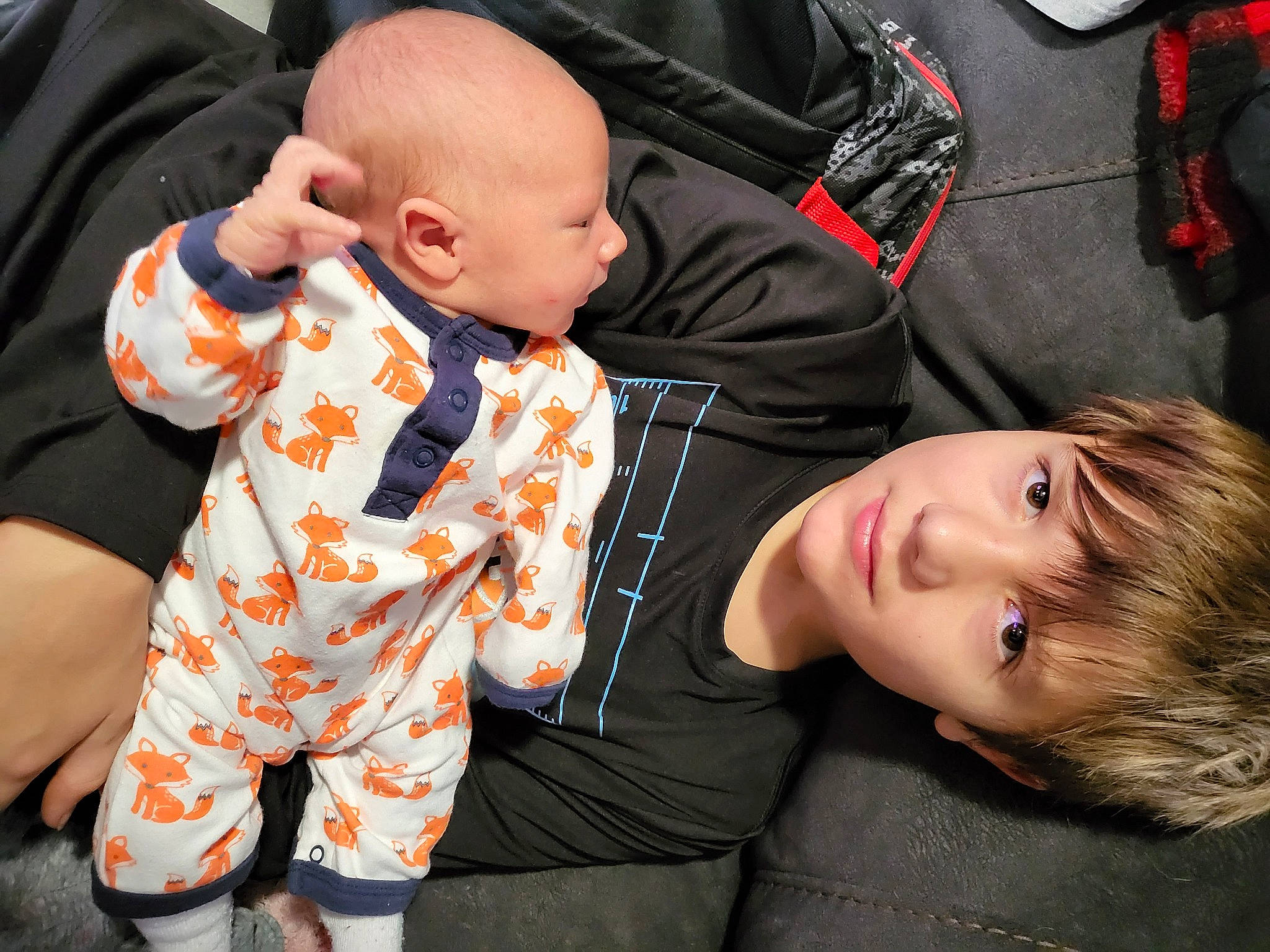 Zaydin joined the competition — help win amazing prizes! baby, baby_products, baby_toddler_clothing, cheek, child, comfort, facial_expression, fun, gesture, hairstyle, happy, human, interaction, orange, pattern, person, plaid, sitting, sleeve, toddler