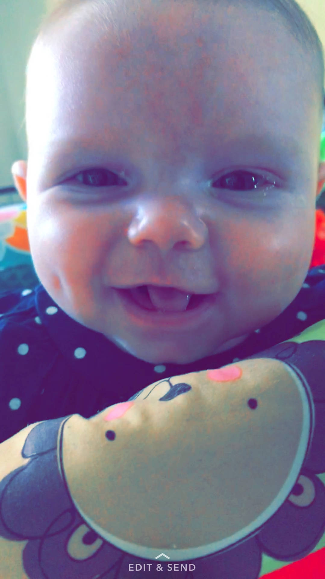 Gabriella is registered to the contest to win money with this photo: cheek, child, chin, close_up, ear, eye, eyebrow, face, forehead, head, infant, iris, lip, mouth, nose, person, pink, purple, skin, smile