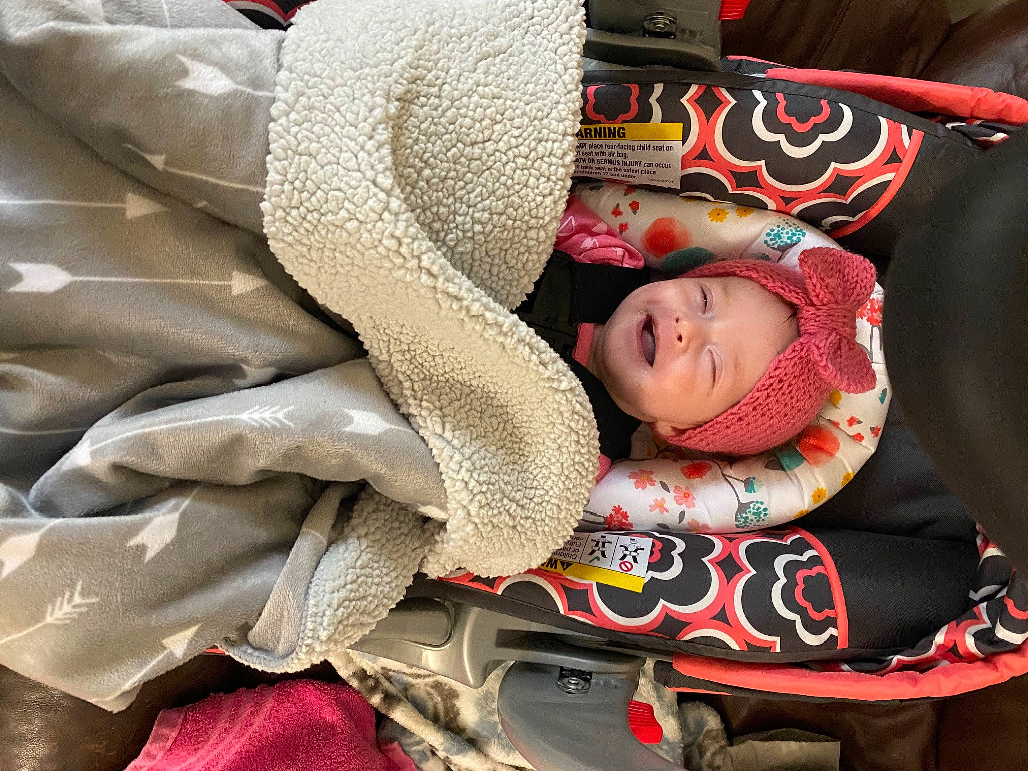 Jocelyn joined the competition — help win amazing prizes! auto_part, baby, baby_carriage, baby_products, cap, car_seat, carmine, child, comfort, facial_expression, fashion_accessory, fun, headgear, headwear, knit_cap, pattern, person, sitting, street_fashion, toddler