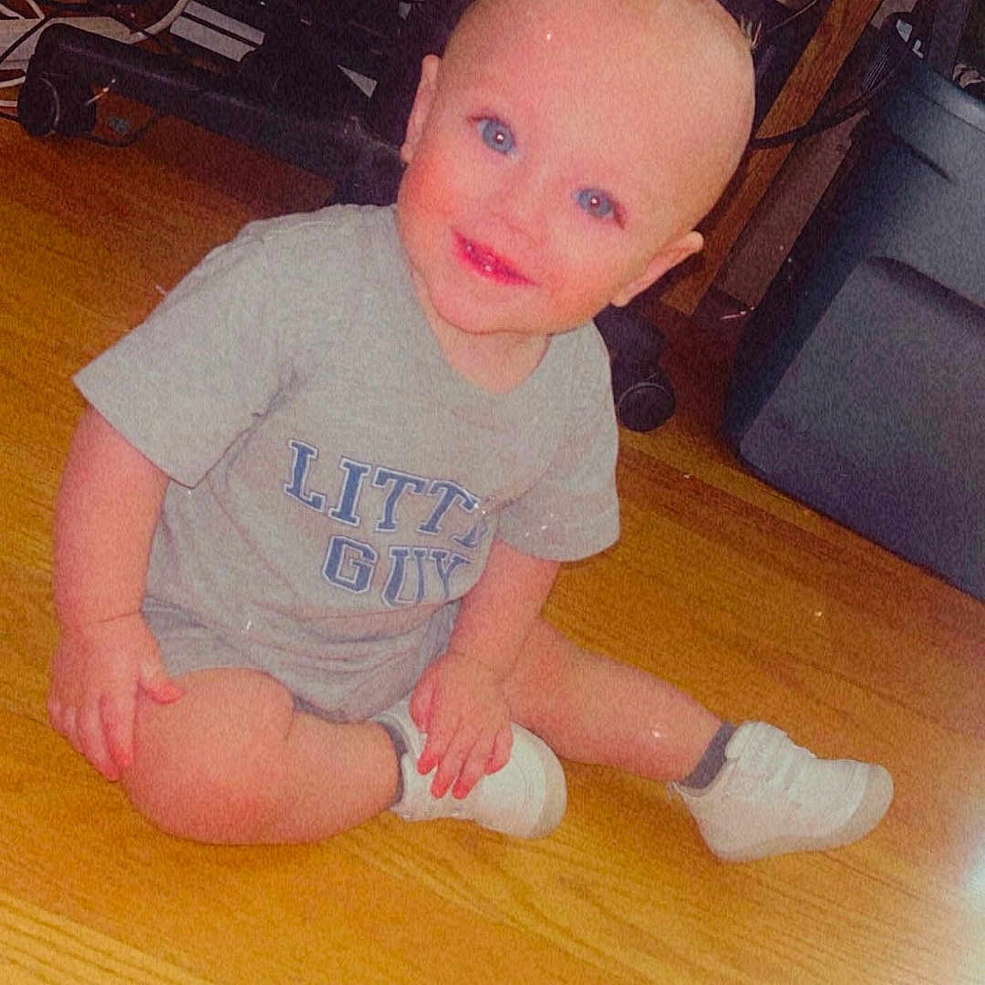 Anakyn joined the competition — help win amazing prizes! baby, bald_head, blue_eyes, cable, casual_clothing, child, cute, floor, furniture, grey_tshirt, happy, indoors, office_chair, person, sitting, smiling, storage_bin, toddler, white_shoes, wooden_floor