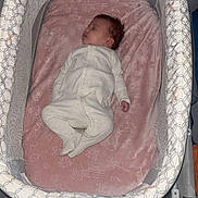 Vidalia joined the competition — help win amazing prizes! newborn, baby, sleeping, bassinet, crib, infant, portrait, indoors, pink_blanket, onesie, baby_gear, nursery, resting, curled_up, peaceful, face, hair, bedding, furniture, photography